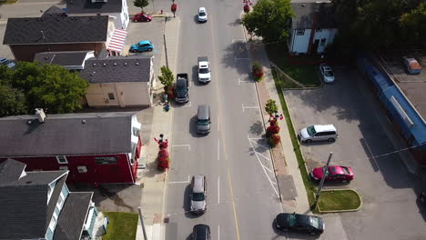 Drone-shot-of-traffic-on-a-side-street-in-a-beautiful-town