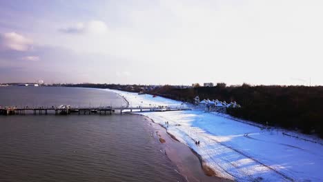 Gdansk-Brzezno-pier-in-winter,-aerial-shot
