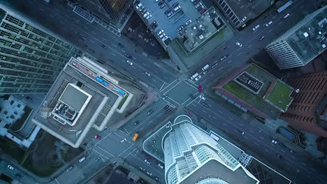 Cinematic-aerial-view-of-a-busy-downtown-intersection