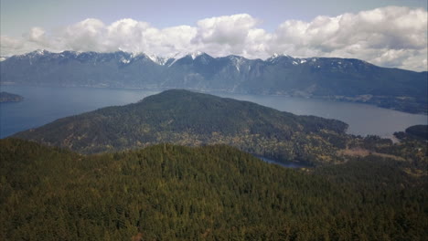 Aerial-view-of-Bowen-Island-forest-and-Mountains,-slow,-higher