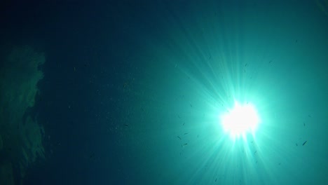 Sun-shot-from-bottom-of-a-lake-with-clear-and-transparent-blue-water