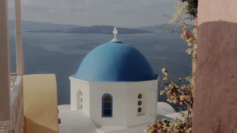 The-blue-dome-of-a-small-Greek-chapel-overlooking-the-sea-view-in-Santorini-Greece