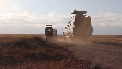 Land-Cruisers-Driving-in-Slow-Motion-Into-Ngorongoro-Safari-at-Sunrise