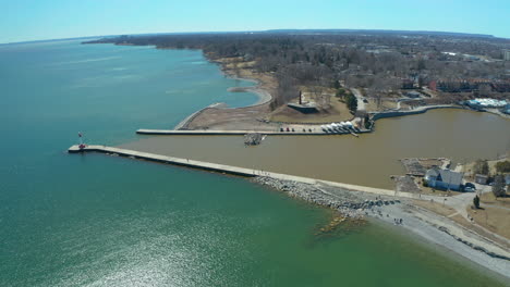 Wide-aerial-view-of-the-marine-and-pier-in-Oakville,-Ontario-on-a-clear,-sunny-day