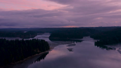 Aerial-of-slough-in-Charleston-Oregon-near-Coos-Bay,-during-a-purple-and-beautiful-sunset