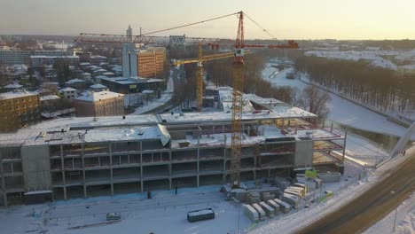 drone-shot-of-cranes-working-at-construction-sait-in-Tartu