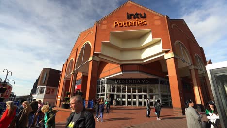 People-shopping,-walking-outside-the-Intu-Potteries-Shopping-Centre-in-Hanley-city-centre-the-main-mall,-precinct