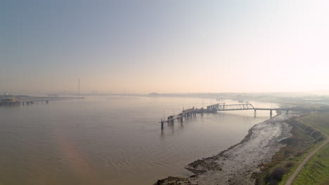 Wide-aerial-view-of-a-ships-jetty-on-the-River-Thames,-Kent---Essex-England