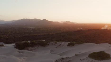 Aerial-time-lapse:-View-from-the-dunes-to-the-sea-of-Cumbuco-at-sunset