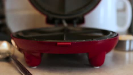 1080p-still-shot-of-quesadilla-maker-lid-opening