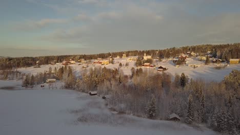 Small-rural-town-of-Borgvattnet-in-Sweden,-next-to-a-frozen-lake
