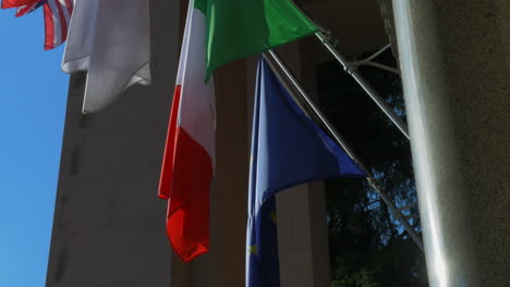 European-and-Italian-flag-in-front-of-a-building