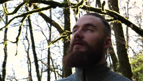 HEADSHOT-of-young-bearded-man-amidst-beautiful-nature