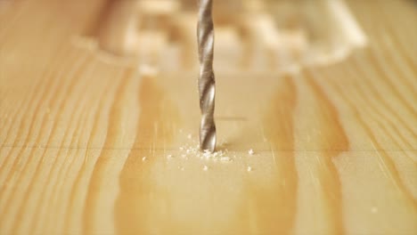 A-slow-motion-Macro-shot-of-Carpenter-drilling-a-piece-of-Timber