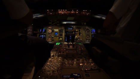 Two-pilots-in-the-cockpit-of-a-Jet-airplane-Airbus-during-a-night-fligth