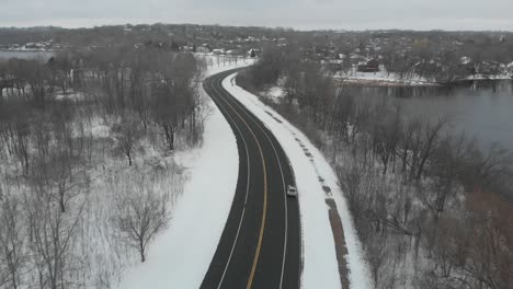 Aerial-footage-of-a-freeway-in-Minnesota-during-a-cloudy-winter-afternoon