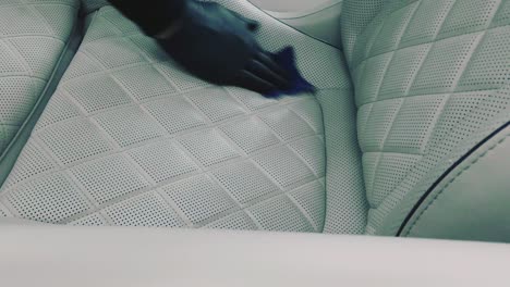 Cleaning-a-white-leather-chair-in-car
