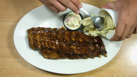 Top-Steady-Shot-Of-BBQ-Ribs-Steak-With-Side-Dish