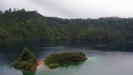 Aerial-shot-of-a-little-island-in-the-Pojoj-Lake-in-the-Montebello-National-Park,-Chiapas