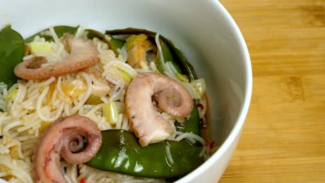 Stir-fry-bowl-of-noodles,-Octopus-and-mangetout