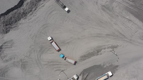Aerial-view-open-method-of-mining-of-coal,-anthracite,-whales,-quarry-dump-trucks