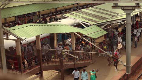 People-busy-in-moving-on-the-staircase-at-urban-Bengaluru-city-railway-station,-Karnataka