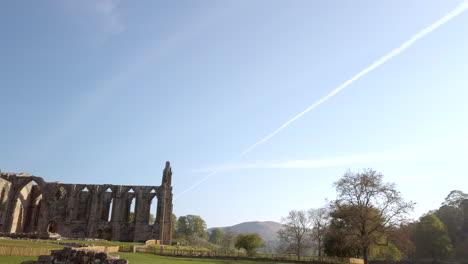 Establishing-Shot-revealing-Bolton-Abbey-Ruins-on-a-Beautiful-Sunny-Summer’s-Morning-in-Yorkshire,-England