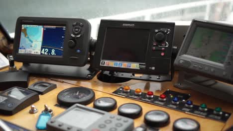 SLOWMO---Captain-steering-boat-in-cockpit-with-control-panel
