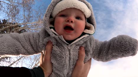 POV-Slo-Mo-shot-of-a-happy-child-being-spun-around-in-the-air