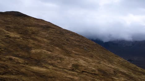 Cinematic-panning-drone-shot-of-cloudy-misty-highland-mountains