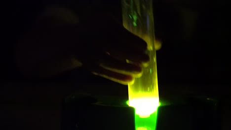 A-lab-tube-glowing-in-the-dark