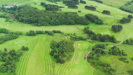 An-aerial-view-over-a-green-golf-course-in-England