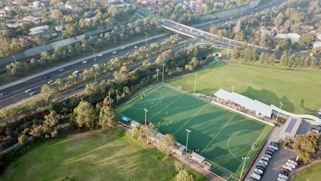 Slow-pan-from-left-to-right-aerial-drone-footage-of-Elgar-Park-field-hockey-ground-and-surrounds