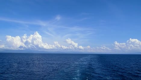View-from-the-stern-of-a-passenger-ship-sailing-the-seas-off-Leyte,-Philippines