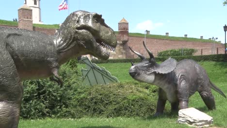 Realistic-two-big-dinosaurs-they-look-at-each-other-in-dino-park
