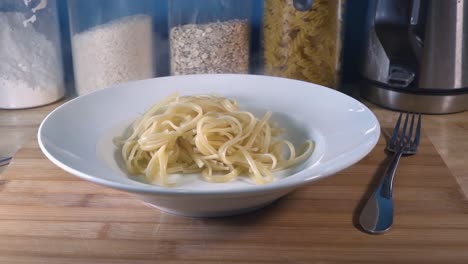 Slow-Motion-Shot-of-Pasta-Being-Served-into-a-Bowl