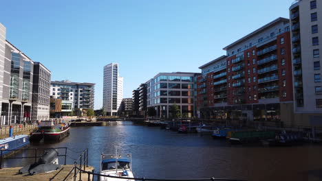 Right-to-Left-Pan-of-Leeds-Dock-Mixed-Development-in-Yorkshire,-UK-on-a-Sunny-Summer’s-Day-with-Blue-Sky