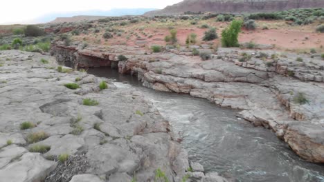 A-scenic-river-running-through-red-rock-basin