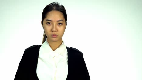 Young-Asian-20s-Woman-black-wrapped-hair-without-cosmetic-make-up-or-fresh-face-look-in-black-suit-express-emotion-still-on-white-background-for-viral-clip-Casting