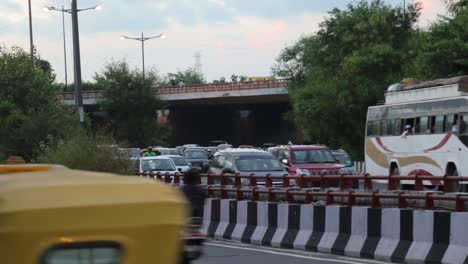 A-Time-lapse-of-moving-traffic-in-New-Delhi,-India