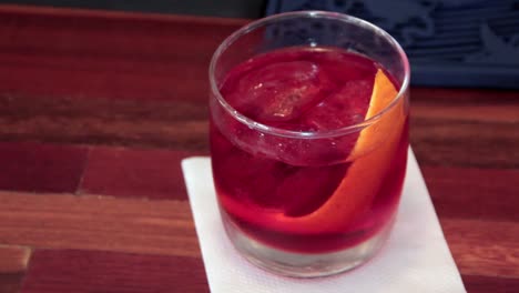 Classic-Negroni-cocktail-served-in-a-cold-glass-with-orange-skin-as-dressing