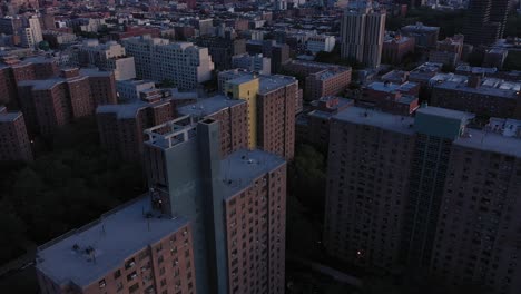 Beautiful-aerial-rollup-from-housing-project-highrise-buildings-to-reveal-the-sunrise-skyline