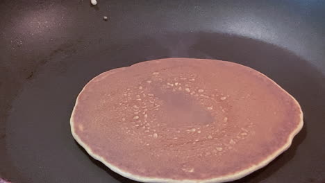 Flipping-a-pancake.-Cooking-breakfast-for-my-baby