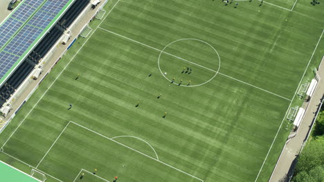 Aerial-establishing-shot-of-Maidstone-FC,-professional-players-training-with-a-pull-back-reveal-of-Maidstone-town
