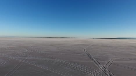 Flying-over-the-Bonneville-Salt-Flats-in-Northwestern-Utah-reveal-tire-tracks-in-the-soft-salt