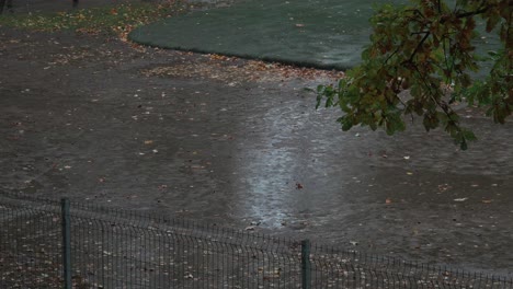 Aerial-static-shot-of-empty-kids-playground-while-raining