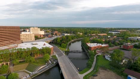 An-aerial-drone-shot-captures-images-of-the-Flint-River-near-downtown-Flint,-Michigan