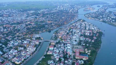 Aerial-view-of-the-Hoi-An,-the-houses-and-the-river-that-cross-the-city,-Vietnam