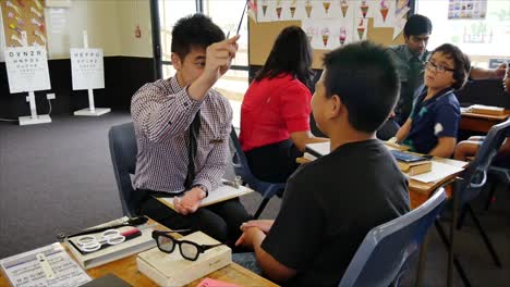 Auckland-New-Zealand-Opticians-checking-the-eye-sight-of-school-children-in-primary-school
