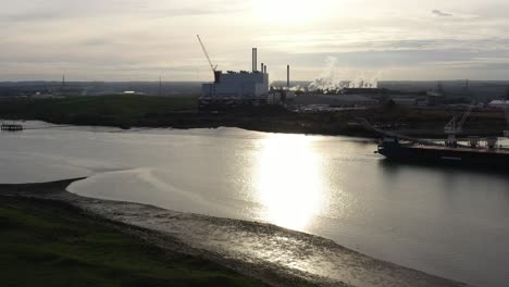 Wide-aerial-profile-shot-of-industry-located-in-Kemsley-on-the-Swale-Estuary-in-the-UK